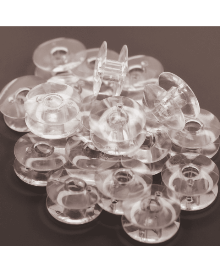 Carretel Plástico para Máquina de Coser Casera x 10 para máquinas de coser caseras, ofreciendo una operación fluida.